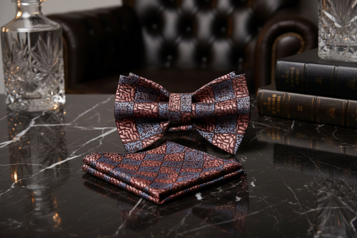 Patterned bow tie and pocket square set on a marble table
