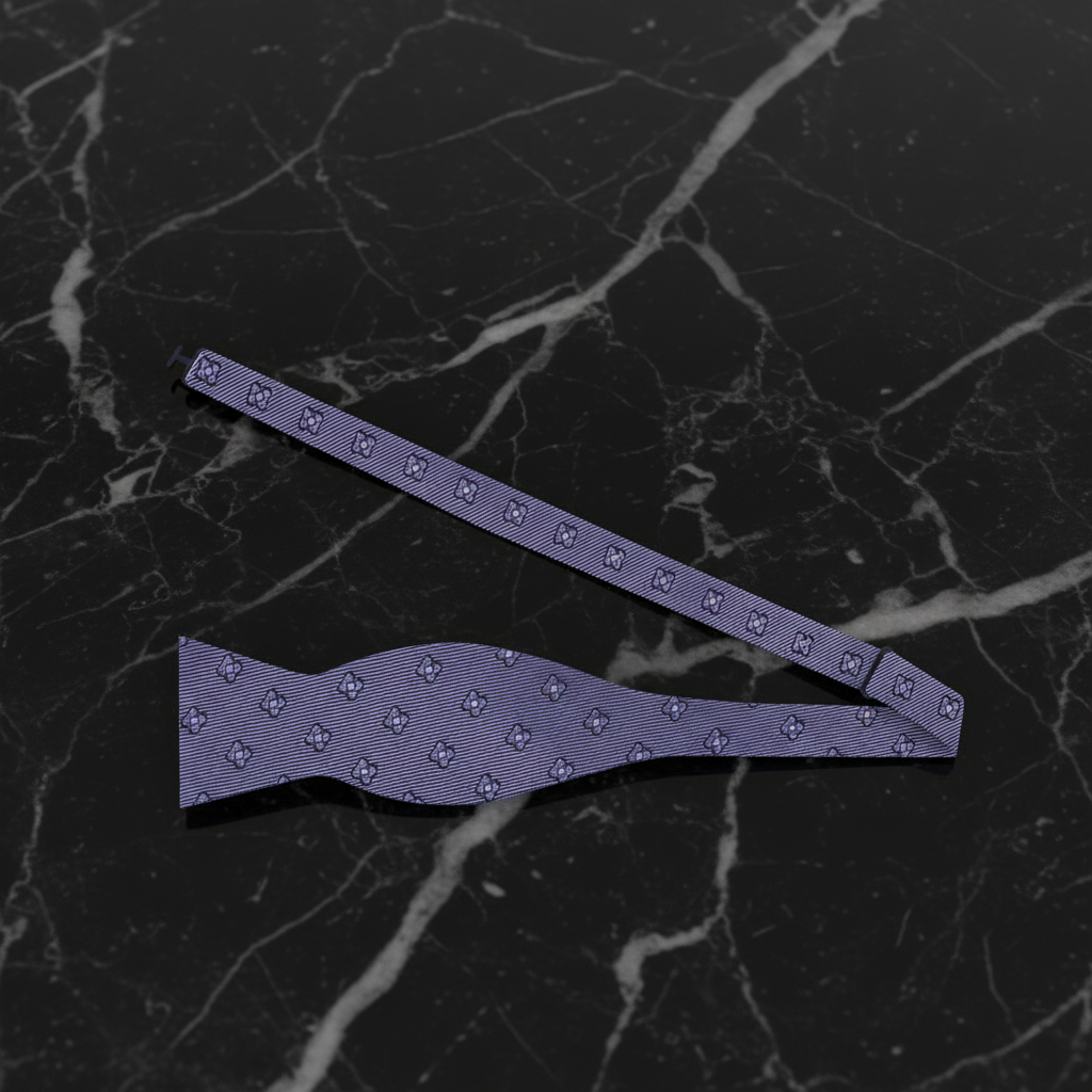 grey bow tie and strap on a black marble background