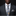 Man wearing a dark gray suit with a floral tie and pocket square against a black background