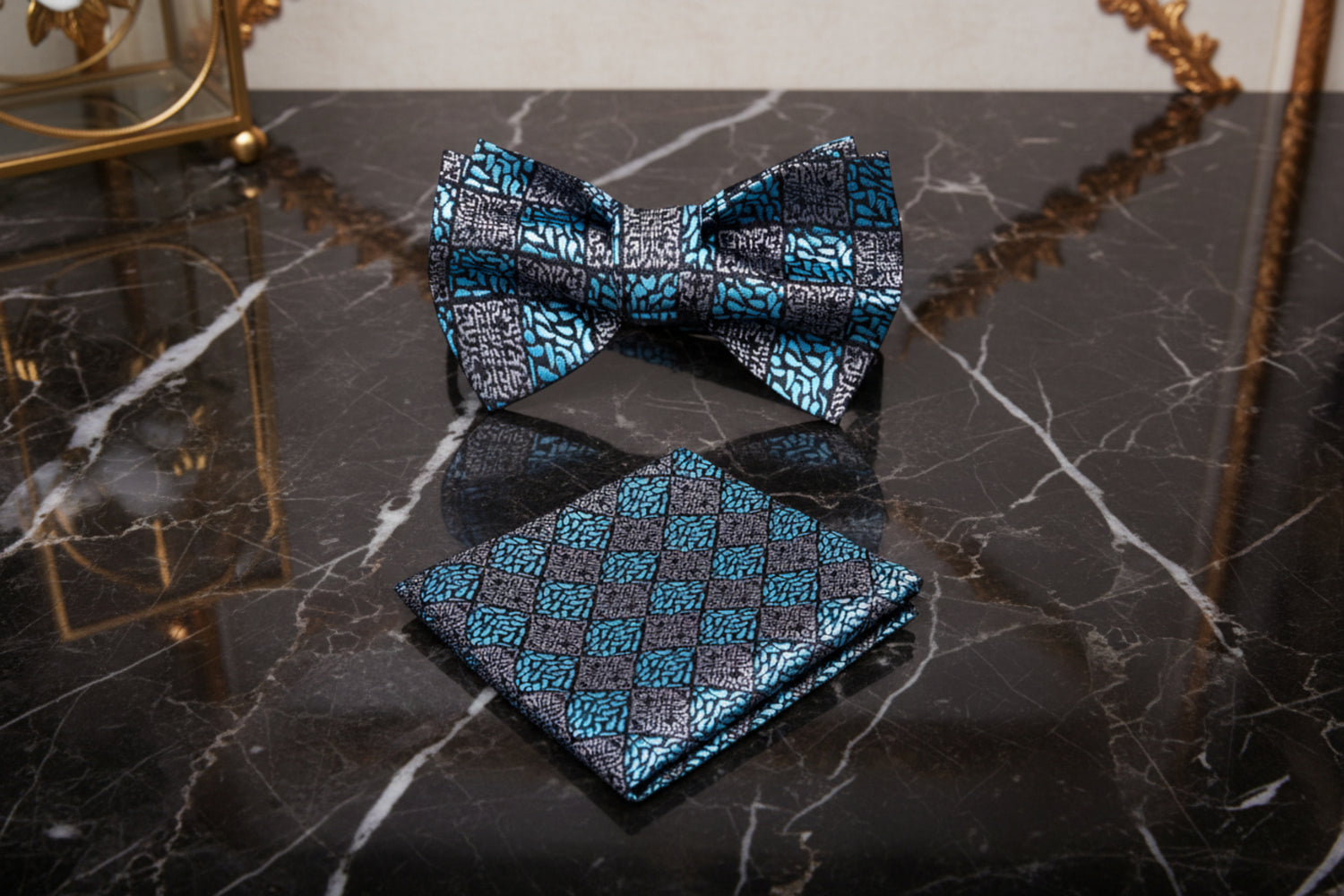 Patterned bow tie and pocket square set on a white background