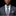 Man wearing a gray suit with a patterned tie and pocket square on a black background