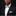 Man wearing a black suit with a white shirt, gray bow tie, and matching pocket square on a black background.