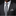 Man wearing a gray suit with a matching tie and pocket square against a black background