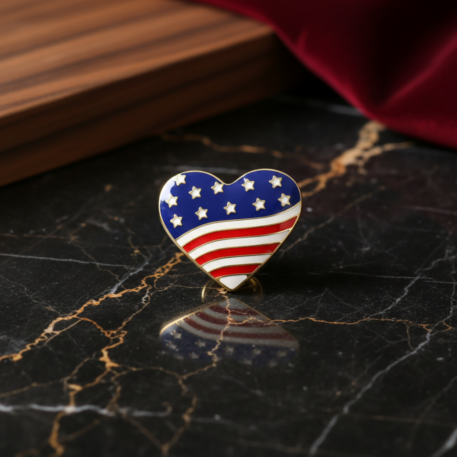 Heart-shaped American flag pin on a marble background