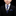 Young boy in a formal suit with a blue tie and pocket square on a black background