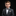 Young boy in a suit with a bow tie on a black background