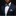 Man wearing a navy suit with a colorful bow tie and pocket square against a black background