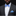 Man wearing a black suit with a white shirt and blue bow tie and pocket square against a black background