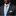 Man wearing a black suit with a blue paisley tie and pocket square on a black background