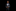 Young boy in a gray suit with a colorful bow tie on a black background