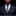 Man wearing a dark suit with a patterned tie against a black background