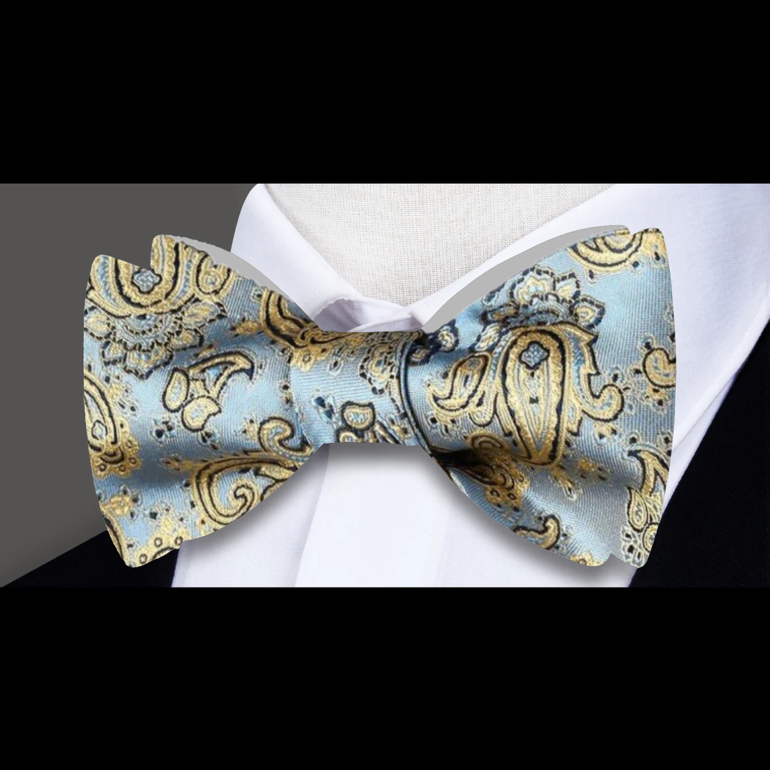 A Light Blue, Gold Paisley Pattern Silk Self Tie Bow Tie