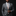 Man wearing a gray suit with a patterned tie and pocket square on a black background