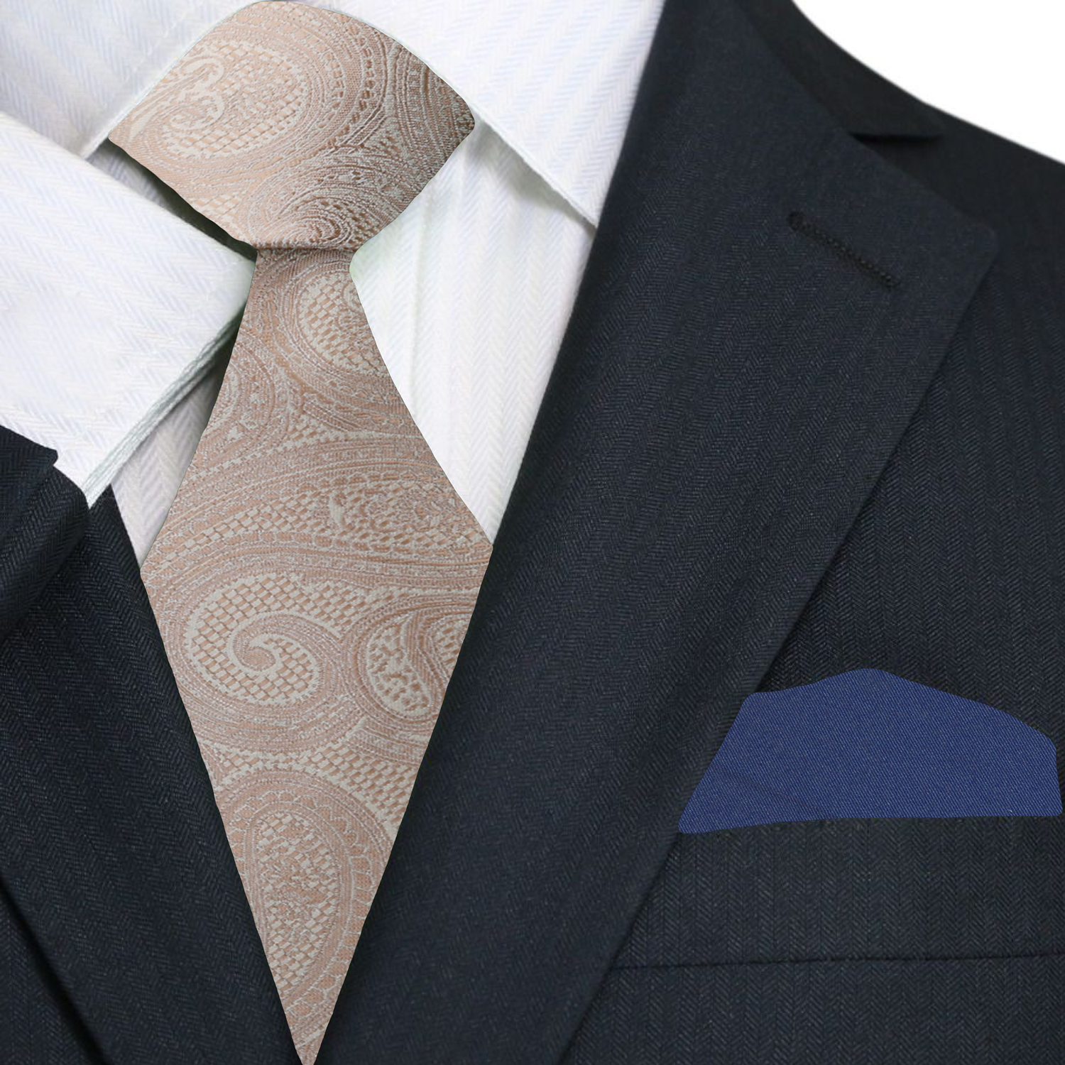 Close-up of a suit with a beige paisley tie and blue pocket square.