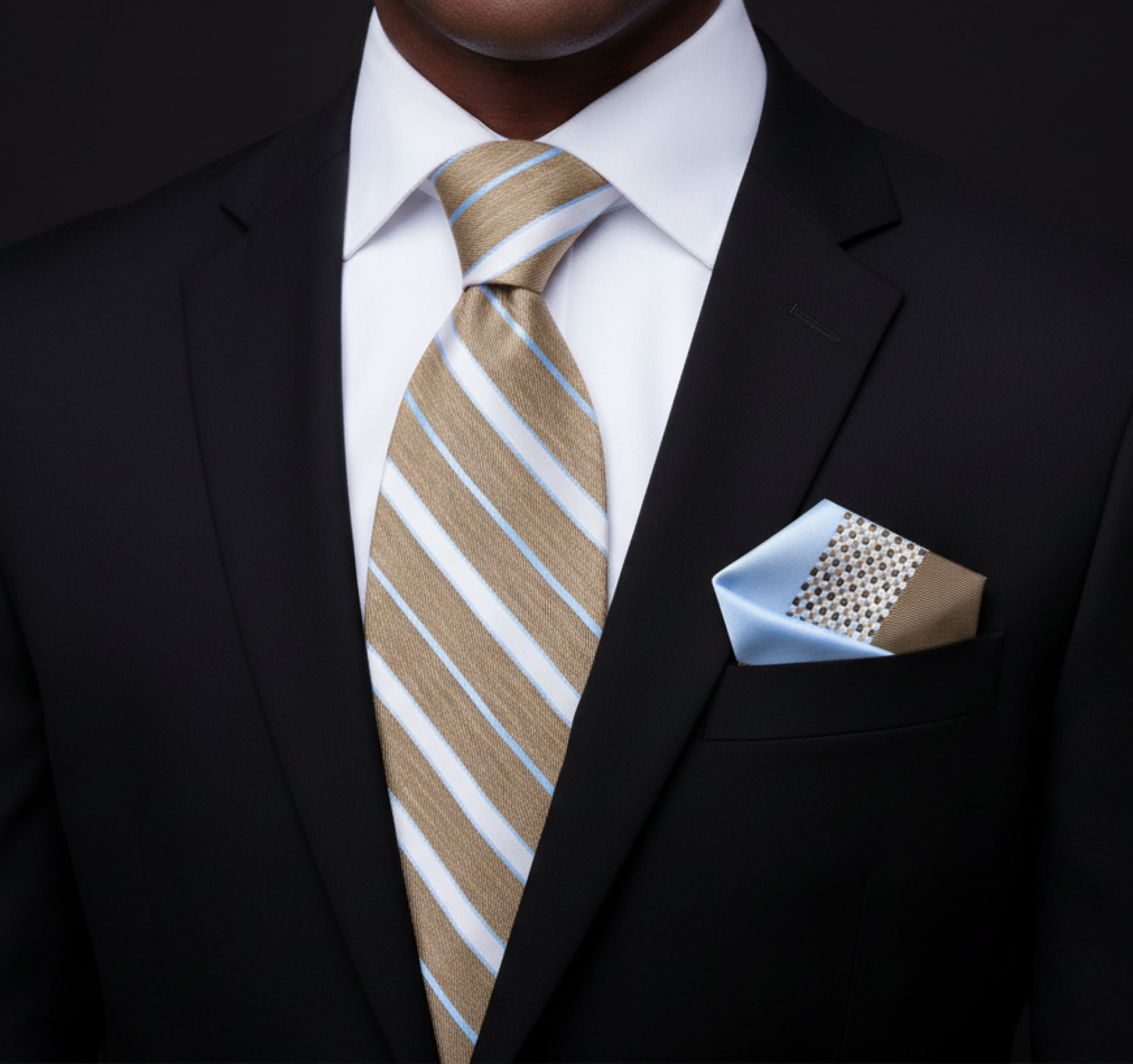 Man wearing a black suit with a brown and white striped tie and matching pocket square.