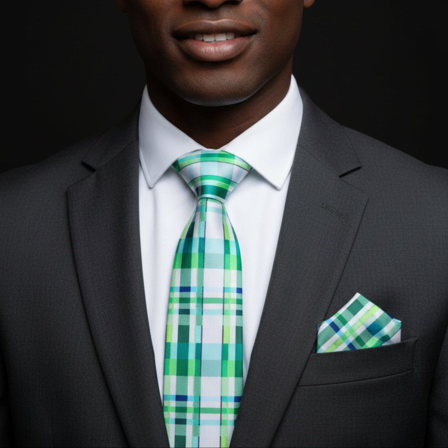 Green plaid tie and square on man