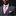 Man wearing a gray suit with a pink tie and pocket square against a black background