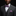 Man wearing a gray suit with a purple bow tie and pocket square on a black background