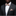 Man wearing a dark suit with a patterned bow tie and pocket square against a black background