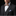 Man wearing a black suit with a colorful bow tie and pocket square on a black background