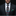 Man wearing a dark suit with a colorful tie and green pocket square on a black background