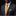Man wearing a gray suit with a yellow tie and patterned pocket square on a black background