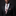 Man wearing a black suit with a floral tie and pocket square on a dark background