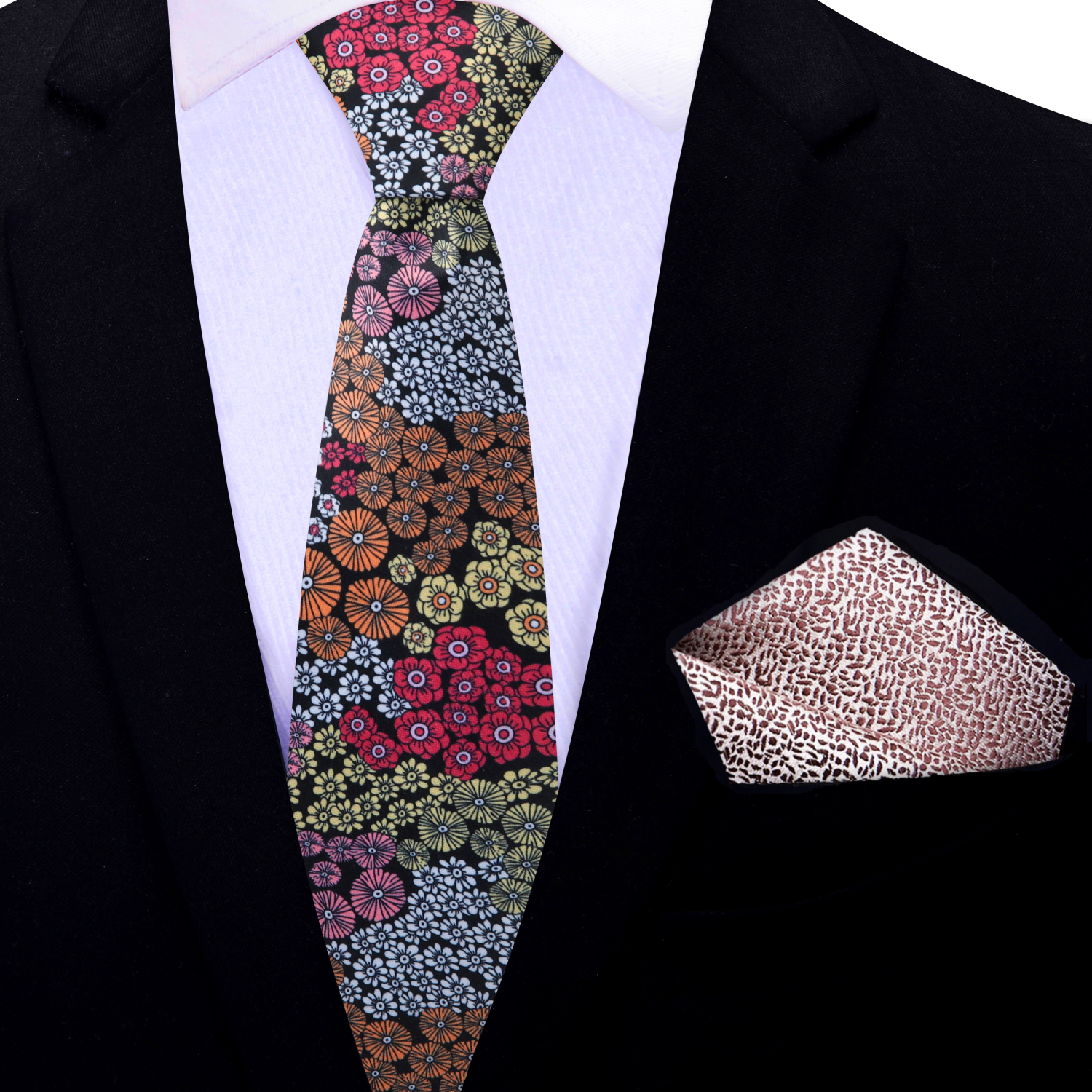 Floral patterned thin tie and accenting pocket square on a black suit jacket.