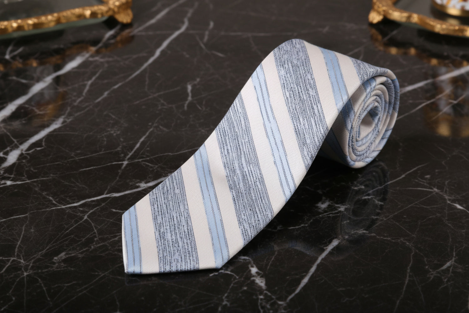 Striped tie with blue and gray pattern on a white background