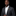 Man wearing a dark suit with a white shirt and a decorative lapel pin on a black background