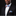 Man wearing a black suit with a colorful bow tie and pocket square on a black background