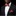 Man wearing a black suit with an orange bow tie and pocket square on a black background