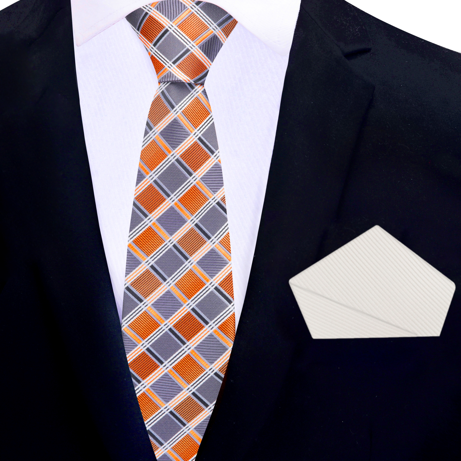 Orange and grey plaid thin tie and cream pocket square on a suit jacket