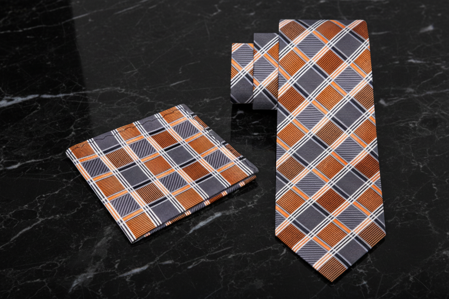 Orange and grey plaid tie and pocket square set with orange and gray pattern