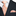 Black suit with white shirt, orange paisley tie, and matching pocket square.