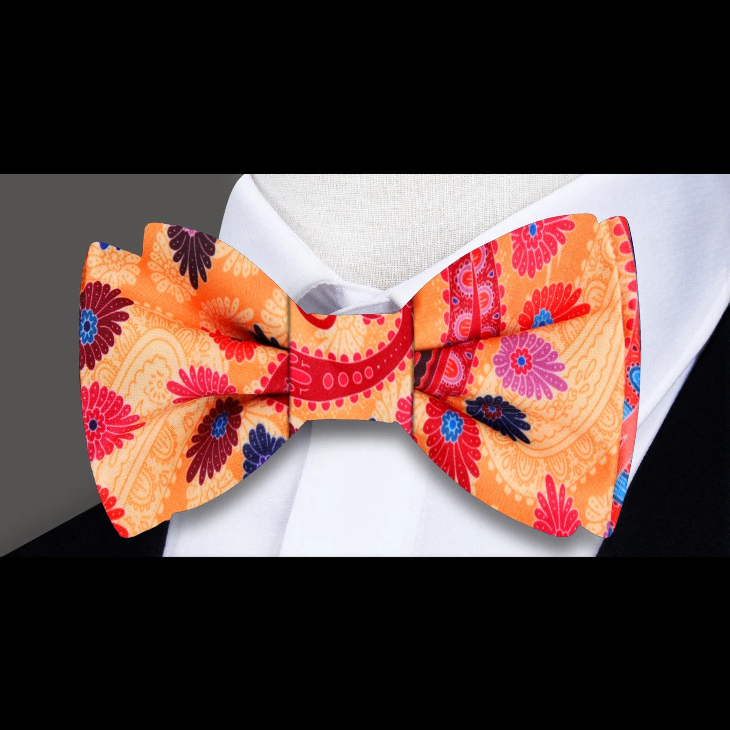 An Orange, Red, Blue, Purple, Pink Paisley Bow Tie