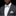 Man wearing a gray suit with a patterned bow tie and pocket square on a black background