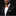 Man wearing a black suit with an orange bow tie on a black background