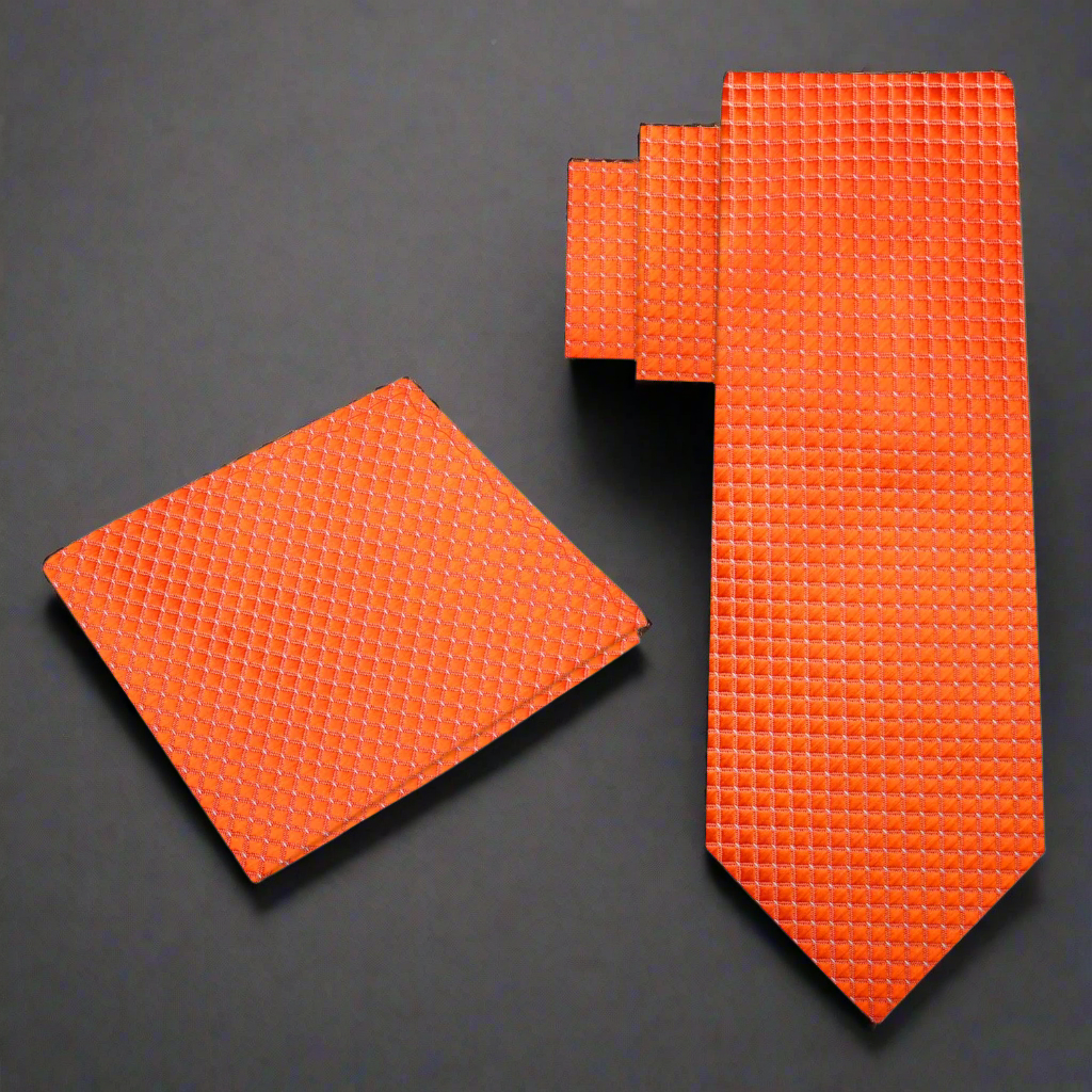 Orange tie and matching pocket square on a background