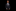 Young boy in a suit and tie against a black background