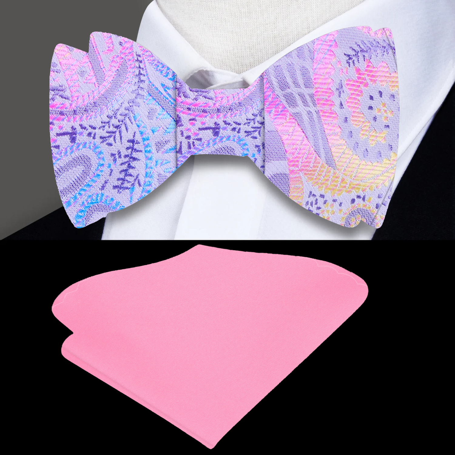 A Pink, Grey, Light Blue, Yellow Paisley Pattern Self Tie Bow Tie and Accenting Pink Pocket Square On Suit