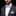 Man wearing a gray suit with a colorful bow tie and matching pocket square on a black background