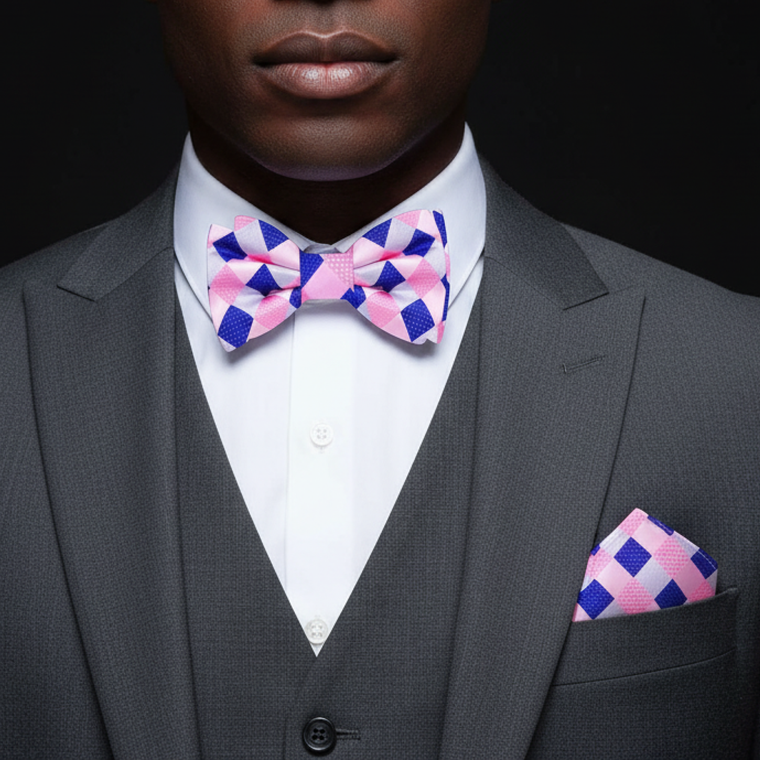 A Pink, Blue Geometric Pattern Pre Tied Bow Tie, Matching Pocket Square on Man