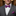 Man wearing a gray suit with a colorful bow tie and pocket square.