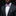 Man wearing a black suit with a white shirt, purple bow tie, and blue pocket square on a dark background