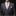 Man wearing a gray suit with a patterned tie and pocket square on a black background