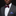 Man wearing plum with multi color dots bow tie and accenting light purple square