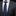Gray suit with blue tie and patterned pocket square on a black background