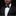 Man wearing a black tuxedo with a bow tie on a dark background