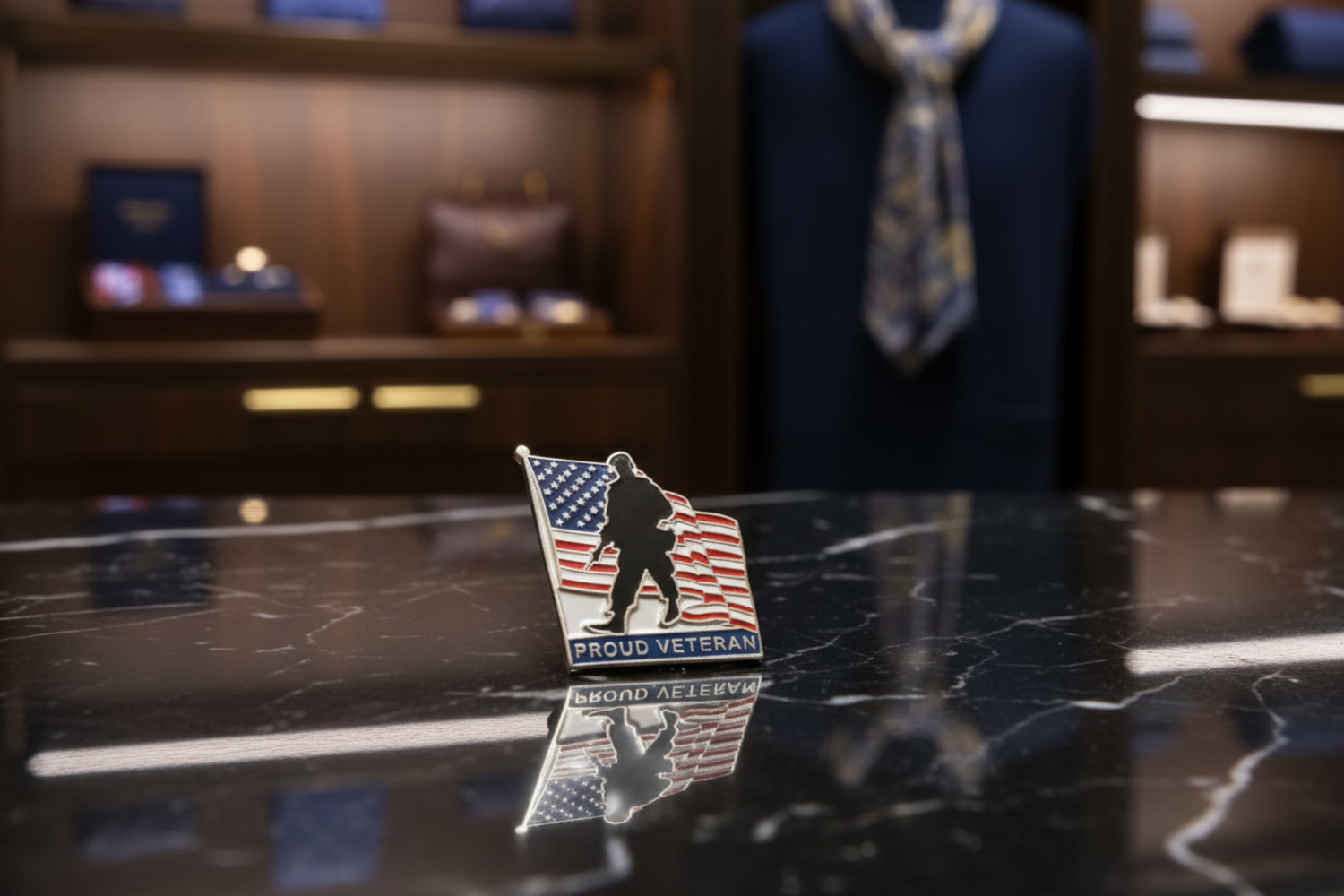 A silver-toned enamel lapel pin shaped like a tilted American flag, featuring a black silhouette of a soldier and the words 'PROUD VETERAN' on a white background.